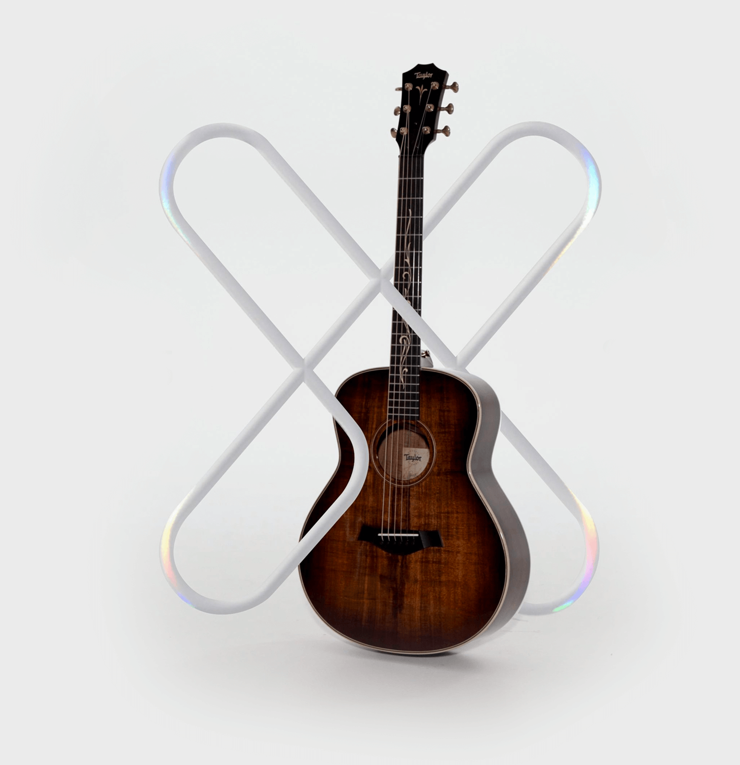 D'Addario XS logo with a Taylor guitar