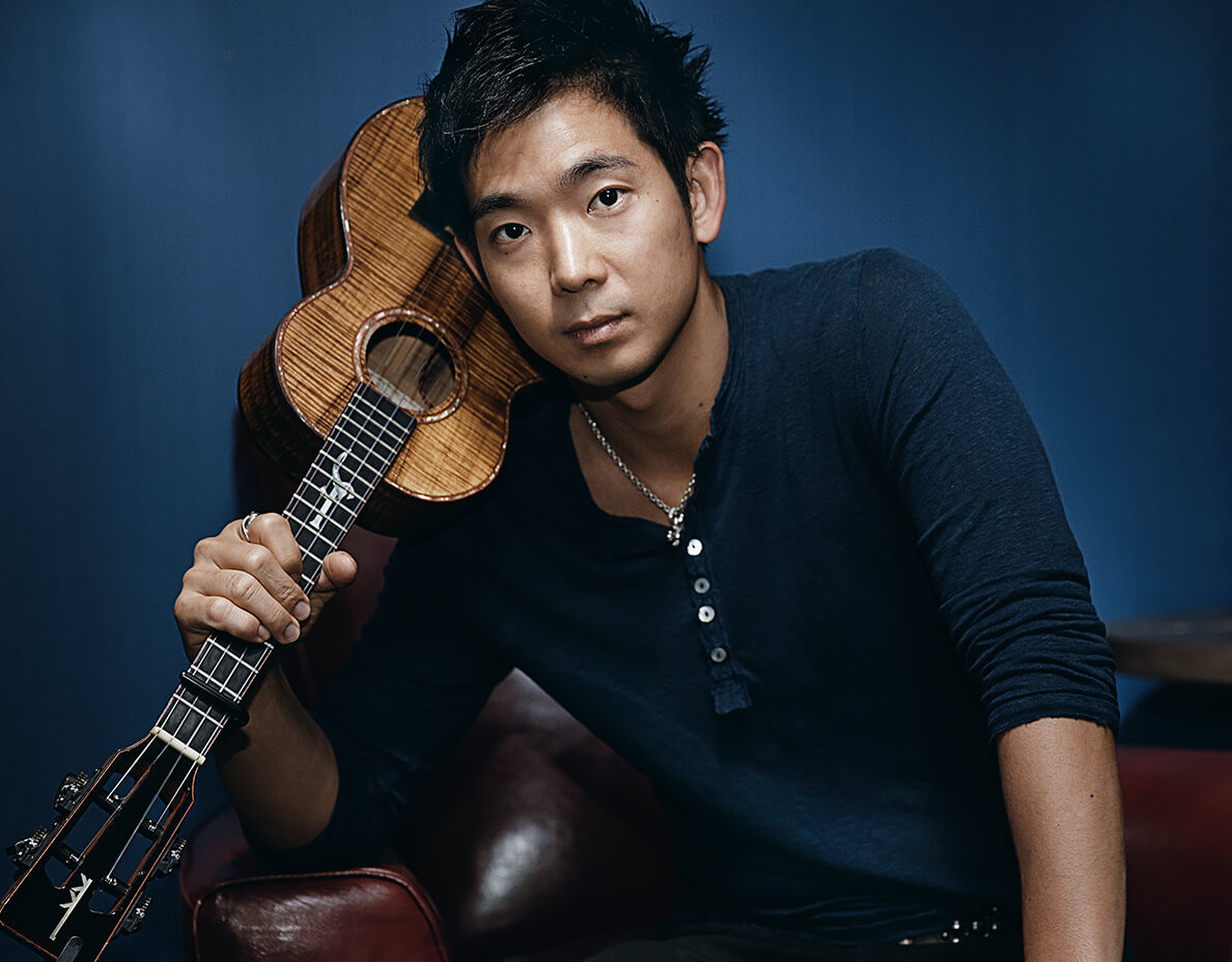 Jake Shimabukuro holding guitar