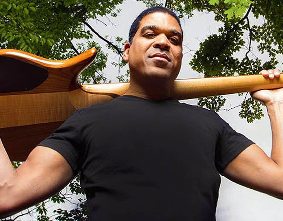 Oteil Burbridge holding guitar