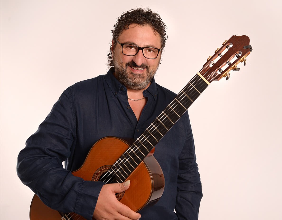 Aniello Desiderio holding guitar