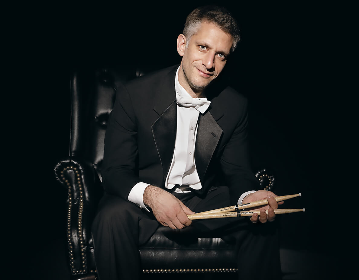 Matthew Strauss holding drum sticks