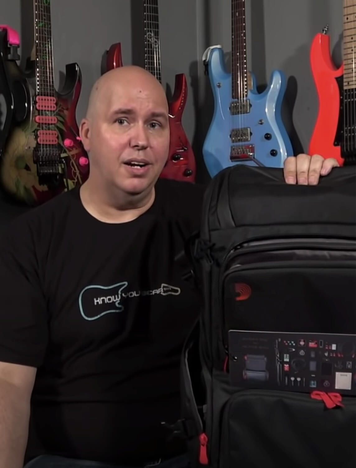 artist holding Gig Bag