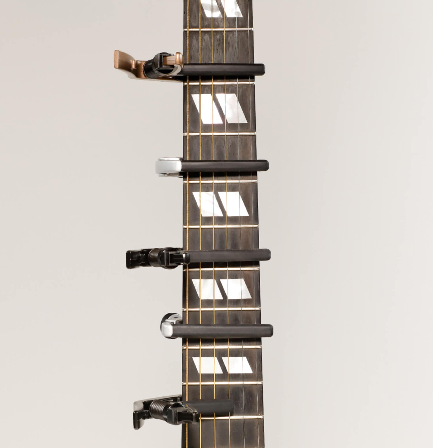 Capos on the neck of a guitar