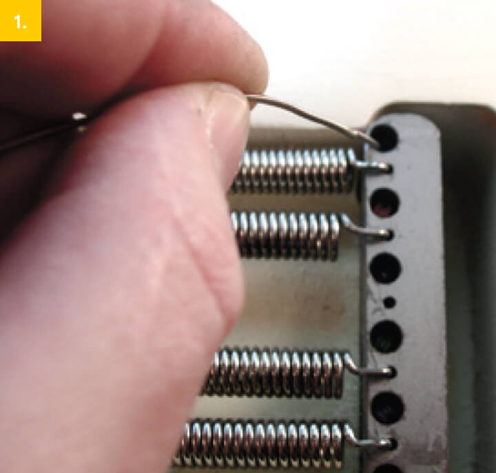 threading guitar string through bridge